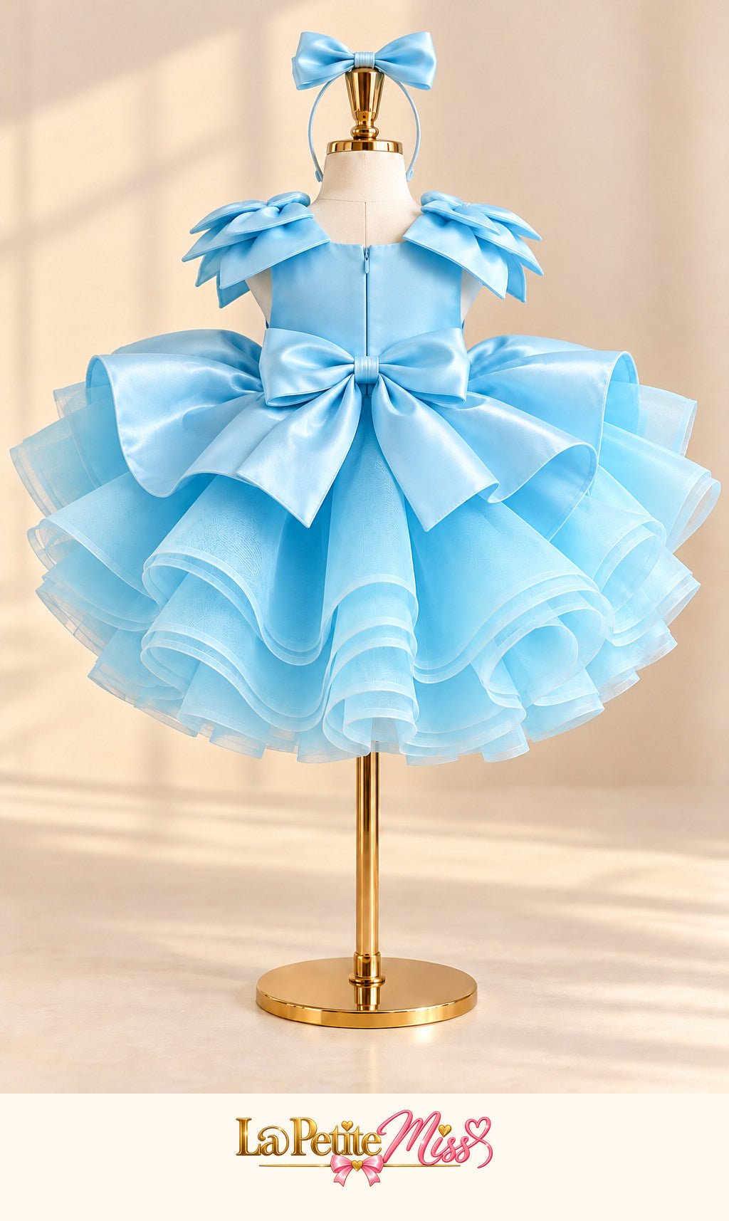 Highness Dress by La Petite Miss, back view of the sky blue girls princess dress with bow