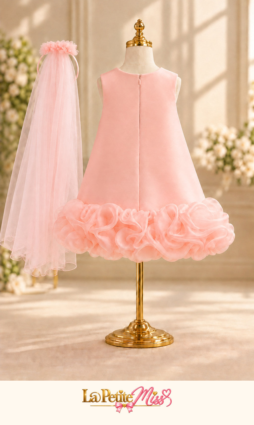 Lady Dress by La Petite Miss, back view of the pink girls dress with ruffled hem