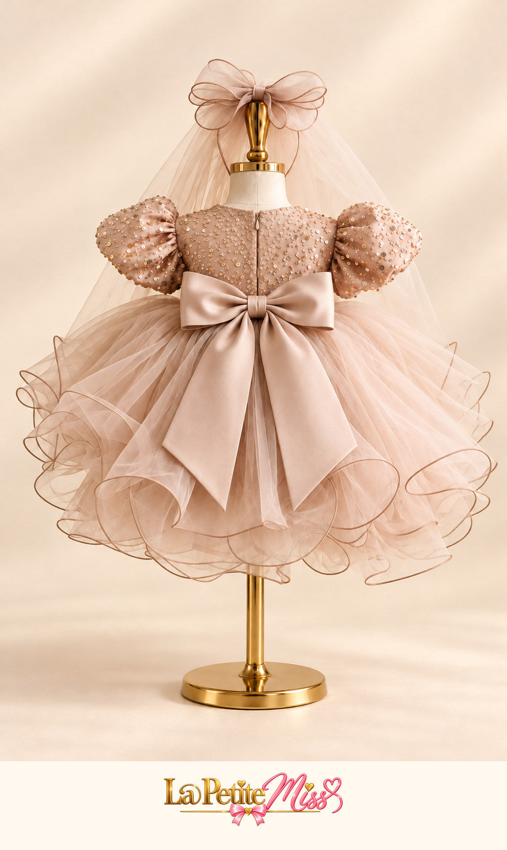 Majesty Dress by La Petite Miss, back view of the champagne pink girls princess dress with satin bow